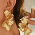 GOLD STATEMENT EARRINGS
